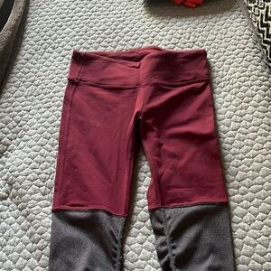 Wine colored Alo Yoga leggings with leg warmer accent